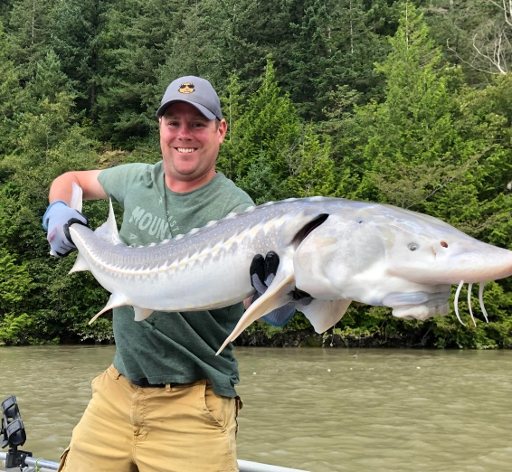 Happy anglers on a sturgeon fishing charter with Mt. Cheam Sportfishing in Chilliwack, BC